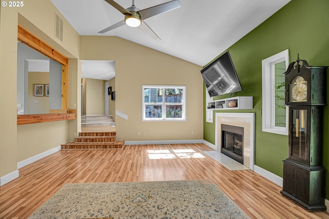 1223 NE 160th Ave, Portland, OR 97230 - unfurnished living room with baseboards, lofted ceiling, wood finished floors, and a fireplace