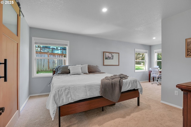1223 NE 160th Ave, Portland, OR 97230 - bedroom featuring baseboards, recessed lighting, a textured ceiling, and light colored carpet
