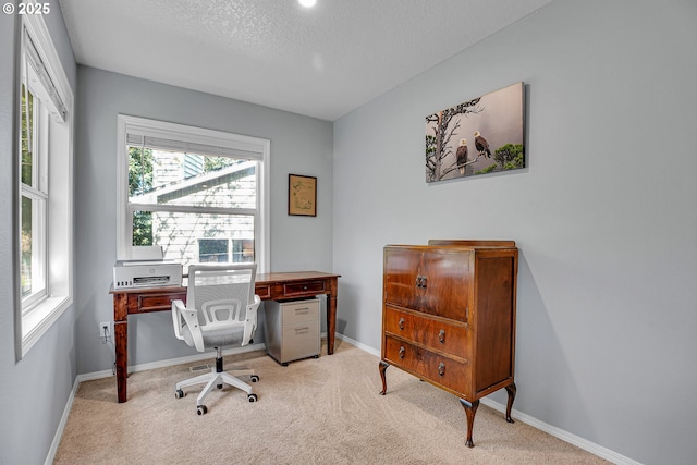 1223 NE 160th Ave, Portland, OR 97230 - office area featuring a textured ceiling, baseboards, and light colored carpet