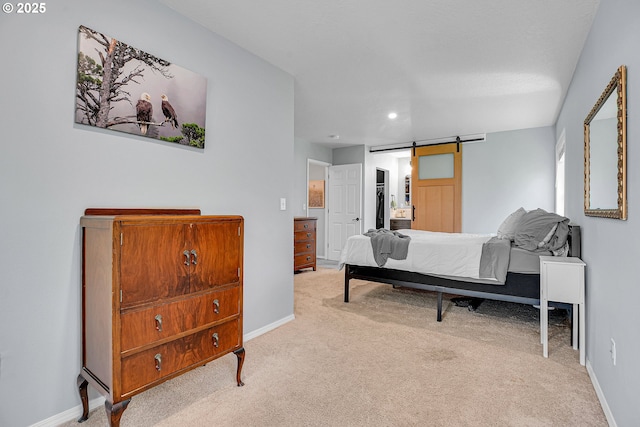1223 NE 160th Ave, Portland, OR 97230 - carpeted bedroom with baseboards, a barn door, and recessed lighting