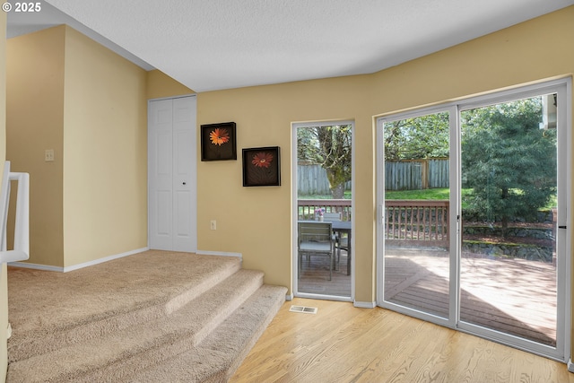 1223 NE 160th Ave, Portland, OR 97230 - entryway with a textured ceiling, baseboards, visible vents, and wood finished floors