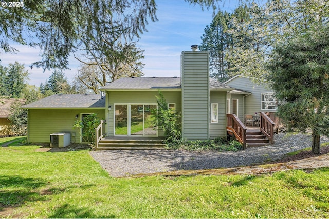 1223 NE 160th Ave, Portland, OR 97230 - rear view of property featuring roof with shingles, a deck, a chimney, cooling unit, and a yard