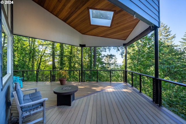 deck featuring an outdoor fire pit