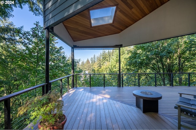 wooden terrace with a fire pit