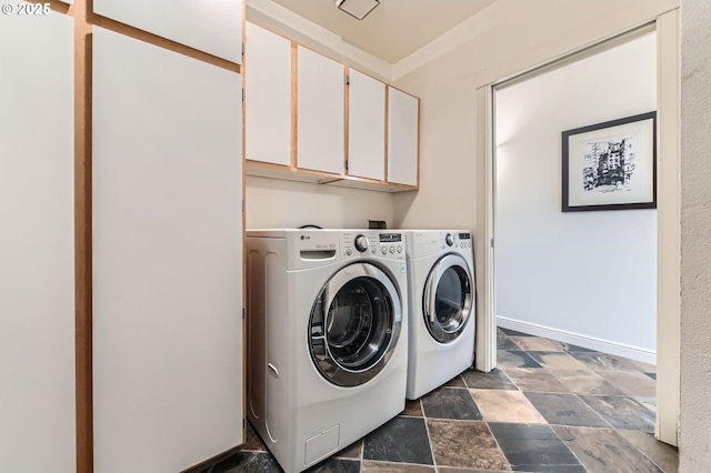 4300 SW Hewett Blvd, Portland, OR 97221 - washroom with cabinet space, dark stone finish flooring, independent washer and dryer, and ornamental molding
