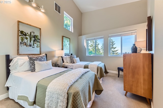 4300 SW Hewett Blvd, Portland, OR 97221 - carpeted bedroom with baseboards and a towering ceiling