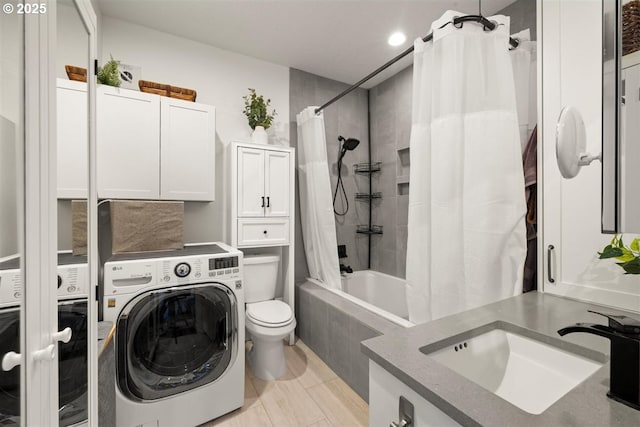720 S 19th Pl, Ridgefield, WA 98642 - bathroom featuring washer / dryer, tiled shower / bath combo, toilet, vanity, and recessed lighting