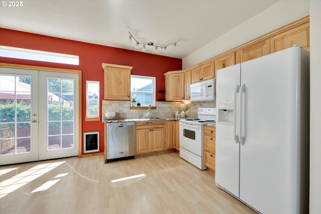 1106 Wilson St, Hood River, OR 97031 - kitchen featuring white appliances, light wood-style floors, french doors, light brown cabinetry, and backsplash