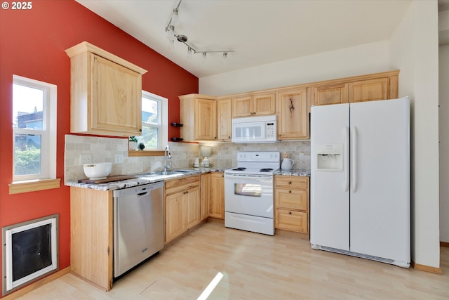1106 Wilson St, Hood River, OR 97031 - kitchen featuring white appliances, light brown cabinetry, light wood-type flooring, decorative backsplash, and a sink