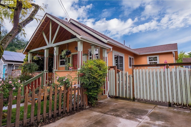 474 Clark St, Eugene, OR 97401 - view of front of house with fence, a porch, and a shingled roof