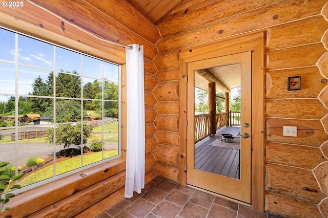 93011 Labeck Rd, Astoria, OR 97103 - doorway featuring lofted ceiling, log walls, and wooden ceiling