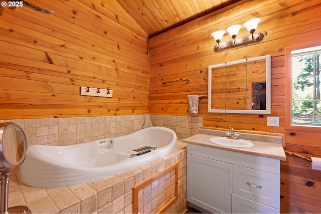 93011 Labeck Rd, Astoria, OR 97103 - full bathroom with vanity, a bath, wood ceiling, and wood walls