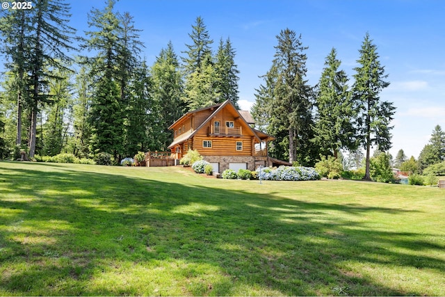 93011 Labeck Rd, Astoria, OR 97103 - view of side of property with stone siding, a yard, a garage, and log siding