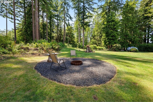 93011 Labeck Rd, Astoria, OR 97103 - view of grassy yard featuring an outdoor fire pit