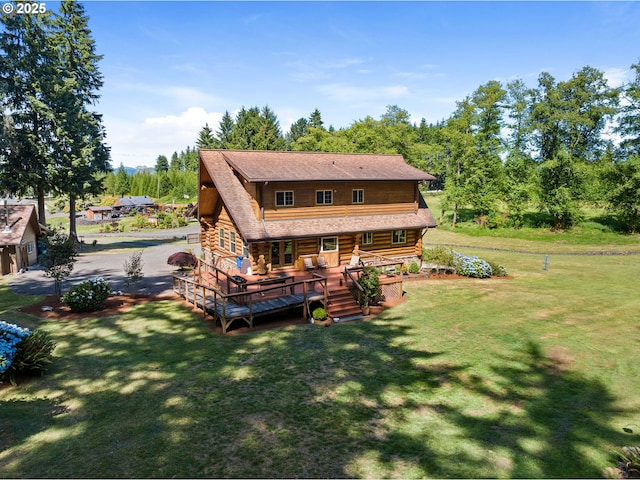 93011 Labeck Rd, Astoria, OR 97103 - rear view of property featuring log siding, a lawn, roof with shingles, and a deck