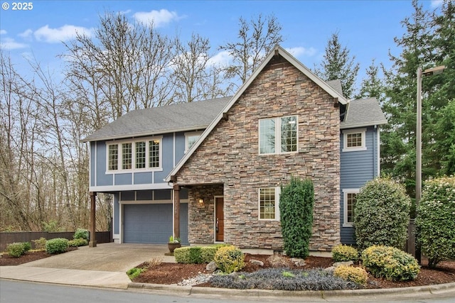 view of front of house with a garage, stone siding, concrete driveway, and a shingled roof