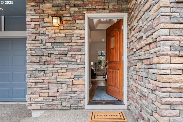 entrance to property featuring stone siding