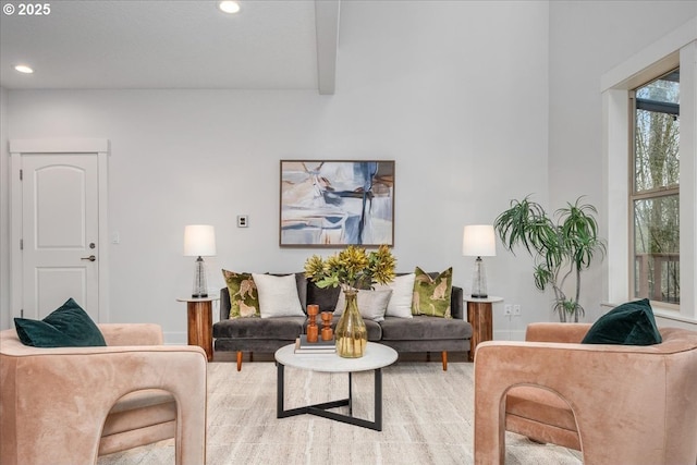 living area with beamed ceiling and recessed lighting