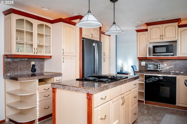 kitchen with hanging light fixtures, a center island, backsplash, and black appliances