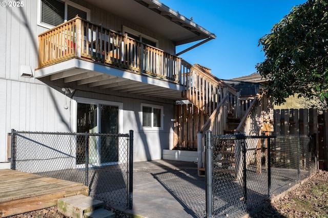 entrance to property with a balcony