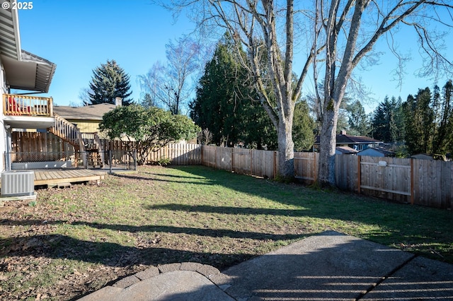 view of yard with cooling unit and a wooden deck