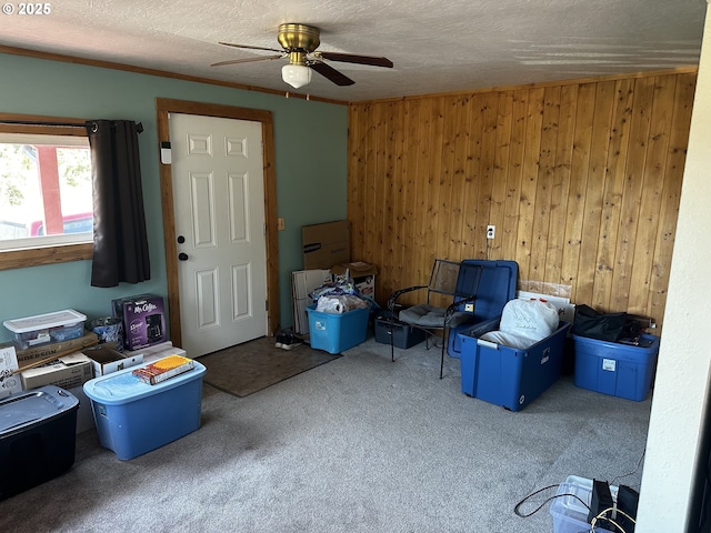 77668 Dugan Ln, Cottage Grove, OR 97424 - miscellaneous room with carpet, a ceiling fan, wood walls, and a textured ceiling