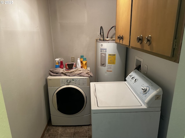 77668 Dugan Ln, Cottage Grove, OR 97424 - laundry room featuring electric water heater, cabinet space, and washer and clothes dryer