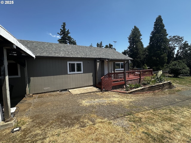 77668 Dugan Ln, Cottage Grove, OR 97424 - ranch-style house with a shingled roof and a garden