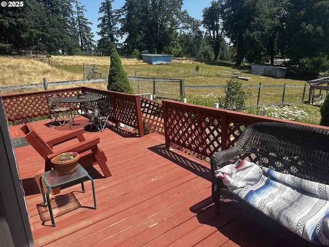 77668 Dugan Ln, Cottage Grove, OR 97424 - wooden terrace with outdoor dining area, view of scattered trees, and a view of rural / pastoral area