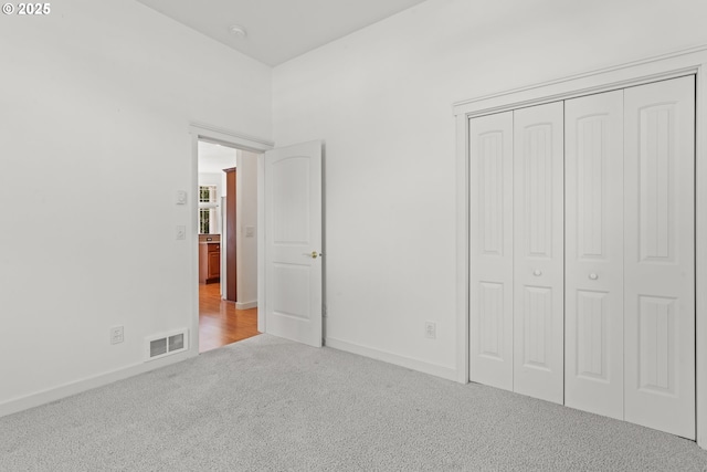 1249 Zebrawood St, Florence, OR 97439 - unfurnished bedroom featuring carpet flooring, a closet, and baseboards