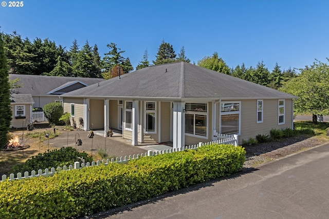 1249 Zebrawood St, Florence, OR 97439 - view of front of house with a porch and a chimney