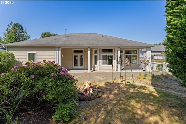 1249 Zebrawood St, Florence, OR 97439 - rear view of house featuring french doors, an outdoor fire pit, and a patio