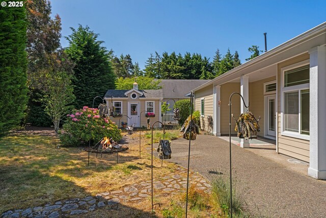 1249 Zebrawood St, Florence, OR 97439 - view of yard with an outdoor structure and a patio area