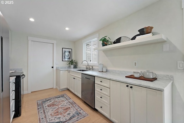 4038 NE Multnomah St, Portland, OR 97232 - kitchen featuring open shelves, dishwasher, black electric range, white cabinets, and light wood-style flooring