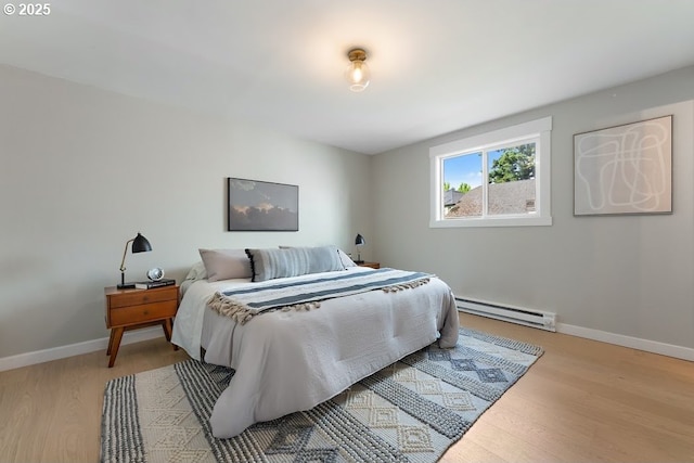 4038 NE Multnomah St, Portland, OR 97232 - bedroom featuring baseboard heating and light wood-type flooring