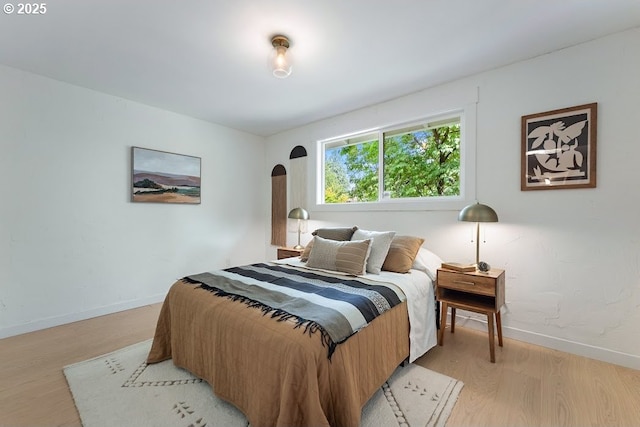 4038 NE Multnomah St, Portland, OR 97232 - bedroom with light wood-style floors and arched walkways
