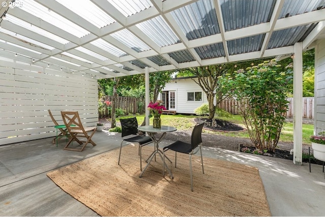 4038 NE Multnomah St, Portland, OR 97232 - fenced backyard featuring a patio area, an outdoor structure, and a pergola