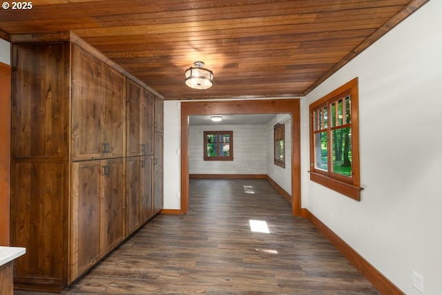 2517 Wild River Dr, Roseburg, OR 97470 - hall featuring wood ceiling, baseboards, and dark wood-type flooring