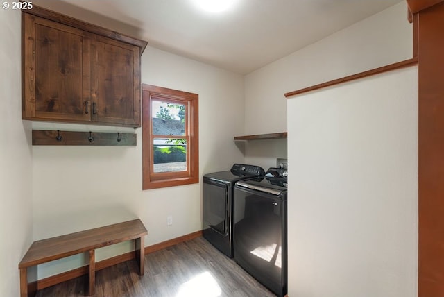 2517 Wild River Dr, Roseburg, OR 97470 - laundry area featuring baseboards, cabinet space, light wood-style flooring, and washer and clothes dryer