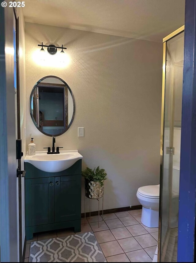 2517 Wild River Dr, Roseburg, OR 97470 - bathroom featuring tile patterned floors, a shower with shower door, vanity, and toilet