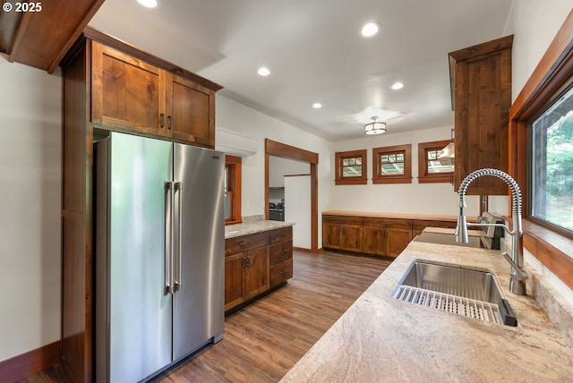 2517 Wild River Dr, Roseburg, OR 97470 - kitchen with dark wood-style flooring, light stone countertops, a sink, recessed lighting, and high quality fridge