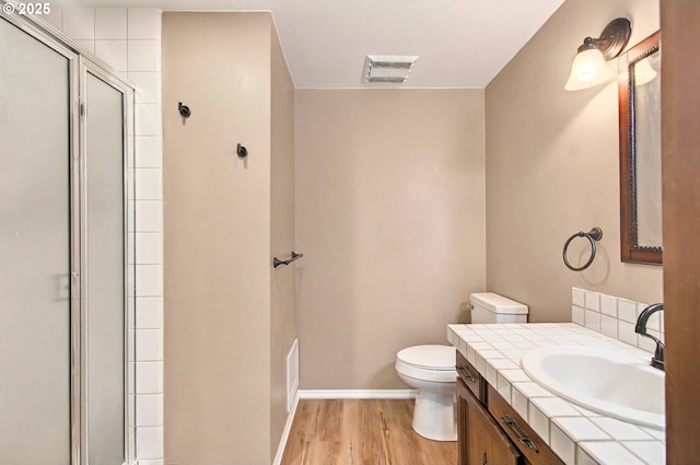 950 N Shasta Way, Clatskanie, OR 97016 - bathroom featuring toilet, vanity, a shower stall, and wood finished floors