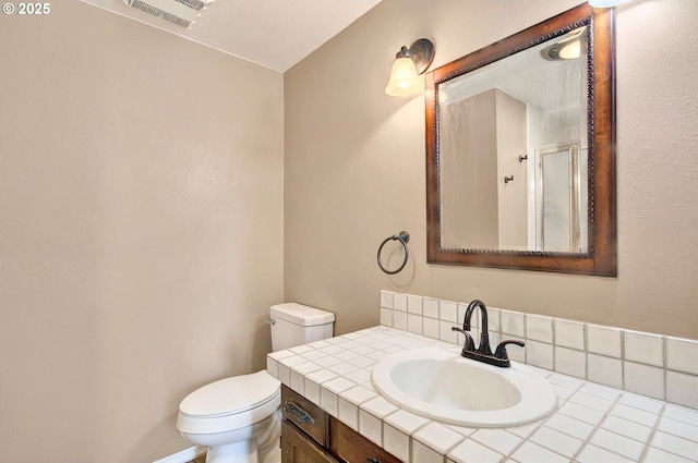 950 N Shasta Way, Clatskanie, OR 97016 - bathroom with toilet, vanity, and an enclosed shower