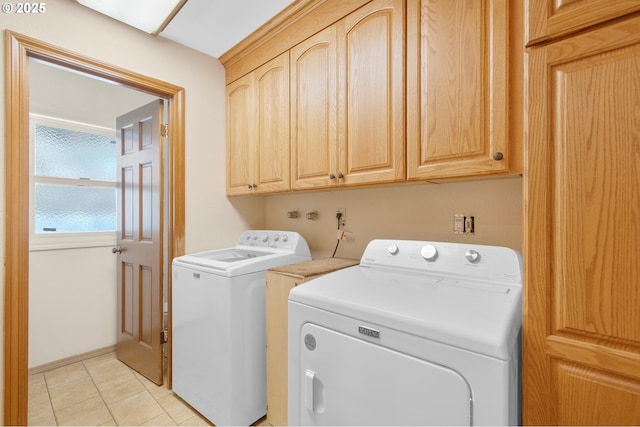 950 N Shasta Way, Clatskanie, OR 97016 - laundry room with washing machine and clothes dryer, cabinet space, and light tile patterned floors
