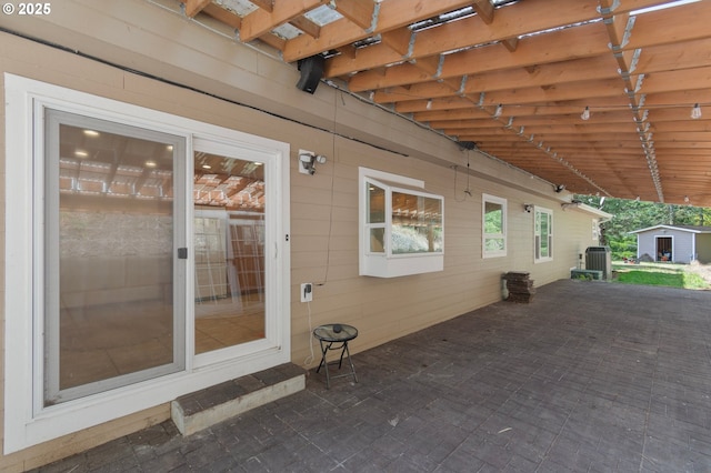 950 N Shasta Way, Clatskanie, OR 97016 - view of patio / terrace featuring central AC unit and a storage unit
