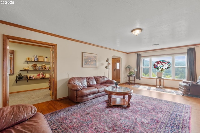 950 N Shasta Way, Clatskanie, OR 97016 - living room with arched walkways, wood finished floors, ornamental molding, baseboards, and a textured ceiling