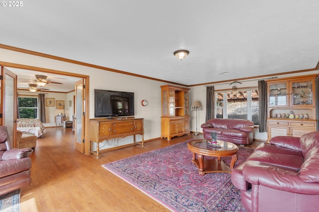 950 N Shasta Way, Clatskanie, OR 97016 - living area featuring ornamental molding, light wood-style floors, baseboards, and ceiling fan