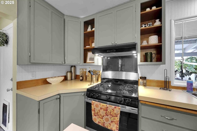 1335 Centennial Blvd, Springfield, OR 97477 - kitchen with stainless steel range with gas cooktop, open shelves, under cabinet range hood, and gray cabinets