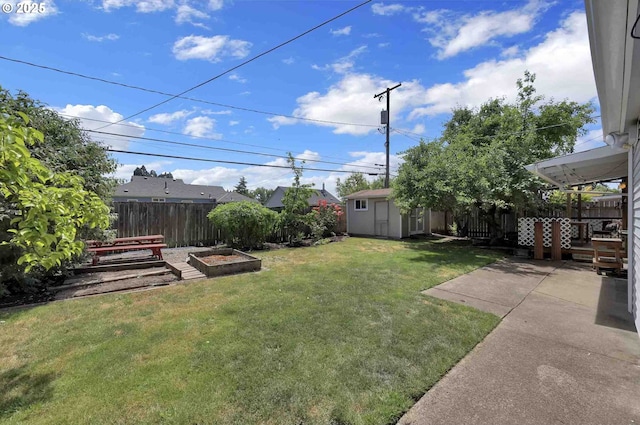 1335 Centennial Blvd, Springfield, OR 97477 - view of yard featuring a vegetable garden and a patio