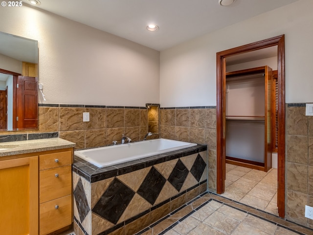 13200 NW Old Germantown Rd, Portland, OR 97035 - full bath with vanity, tile walls, a garden tub, a wainscoted wall, and recessed lighting